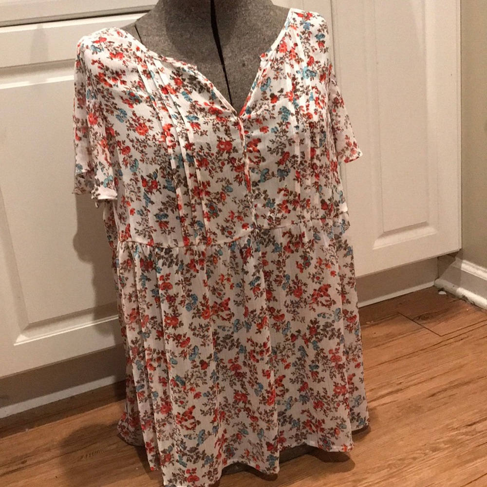 Torrid floral blouse with lace detail.
